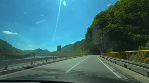 Sun glows bright through windshield. Balkan, Eastern Europe, POV Video stock 333344019