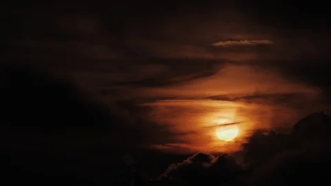 The Sun Goes Behind Dark Wispy Billowing Clouds Video stock 115643686