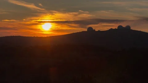 The sun goes behind the mountain sunset timelapse. Video stock 133647841