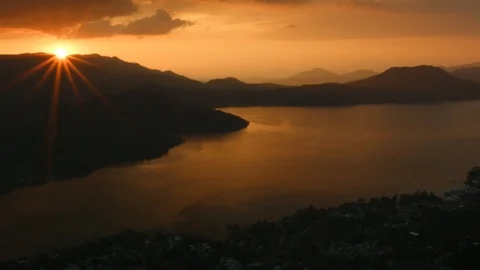 Sun Goes Down Behind Lake And Mountains Stock Footage 93750632