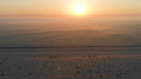 Sun Goes Down in Desert Drone Shot Stock Footage 130073365