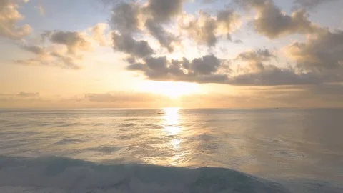 Sun goes down in the ocean with beautiful reflection aerial footage Stock Footage 100612140