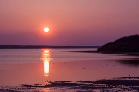 The sun goes down over the East Fleet in Dorset Stock Photos