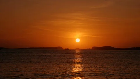 Sun going down behind the mountains on Ibiza island Stock Footage 123090320