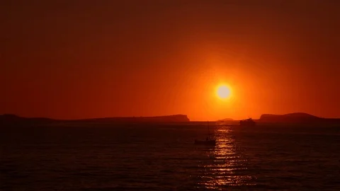 Sun going down in Ibiza on a calm and tranquil summer evening Stock Footage 123089173