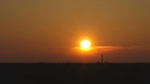 Sun going down near the lighthouse Stock Footage 87808459