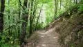 sun gradually illumintates mountain hiking trail HD Footage