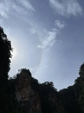Sun Halo Over Limestone Cliffs at Ipoh Mirror Lake Stock Photos