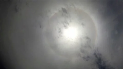 Sun halo ring n sunlight ray or sunbeam on dramatic cloudy sky Stock Footage 161151279
