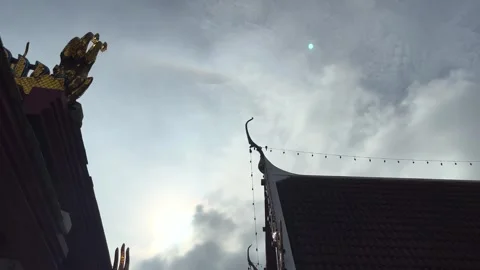 The Sun Halo's Shining And In To The Cloud On Sky With Birds Flying At Temple Stock Footage 277280140