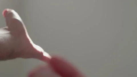 Sun on hands, insert shot with blur. poetic shot, ode to the sun. Home interi Stock Footage 171982983