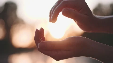 Sun in hands. Slow Motion 120 fps, 4K. Woman catching a sun against sunset 스톡 동영상 65364725