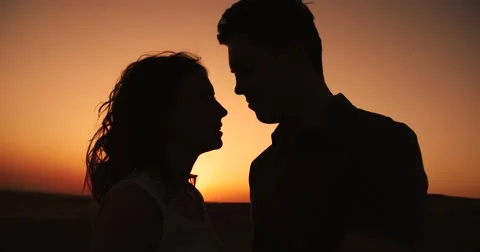 Sun in hands.Happy Couple making shape of Heart beautiful sunset on horizon Stock Footage