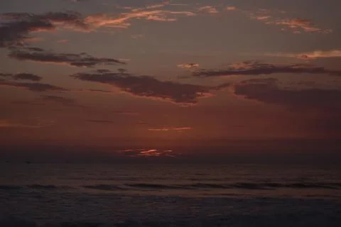 Sun has already gone down in a ocean leaving a beautiful reddish color Stock Photos