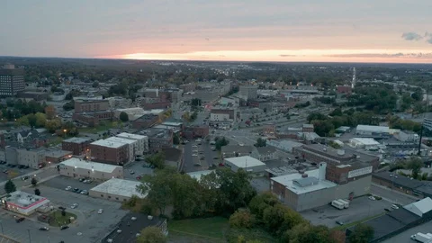 The sun has dipped below the horizon leaving an orange glow over Watertown, New  動画素材 121701837