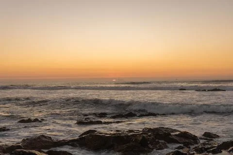 The sun has set, and twilight begins along the shores  Stock Photos