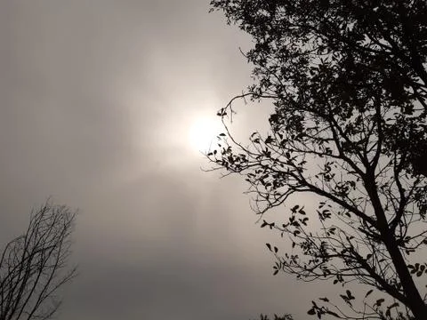 Sun hidden behind the clouds Stock Photos