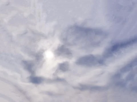 The sun is hidden behind thick clouds. 스톡 사진