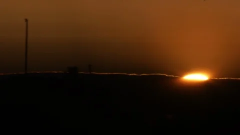 Sun hidding behind clouds Stock Footage 101651610