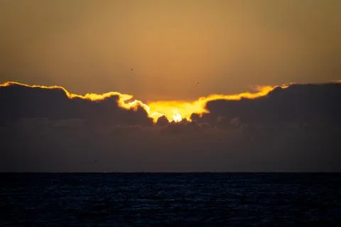 Sun Hides Behind the Clouds Stock Photos