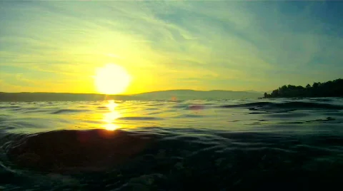 Sun hides behind the lake Video stock 861767