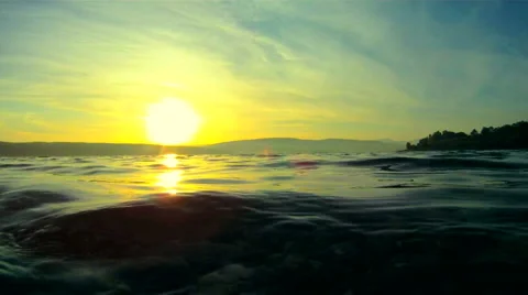 Sun hides behind the lake Stock Footage 1393391