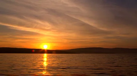 Sun hides behind the lake Stock Footage 1393605