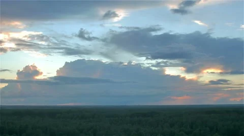 Sun hides behind storm rain cloud over green summer forest. aerial timelapse 스톡 동영상 66241139