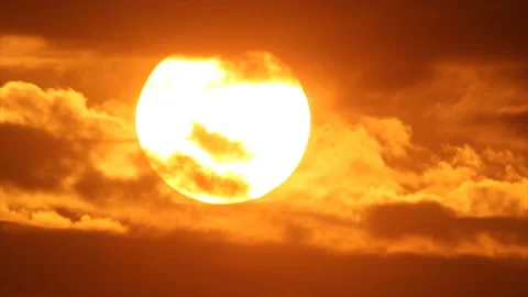 Sun hides in clouds of dark dusk Stock Footage 142658319
