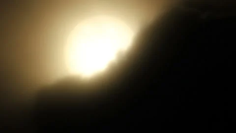 Sun hides in dark fog Stock Footage 122109587