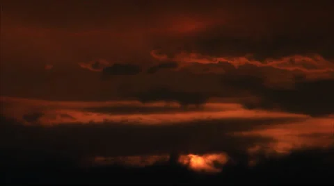 Sun hides in sky clouds Stock Footage 33216796