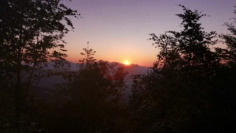 Sun hiding behind the mountains Stock Footage 131458654