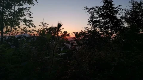 Sun hiding behind the mountains Stock Footage 131458701