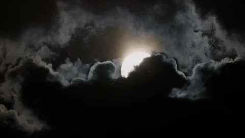 The sun is hiding behind storm clouds. Mystical landscape of the setting sun Video stock 250069834