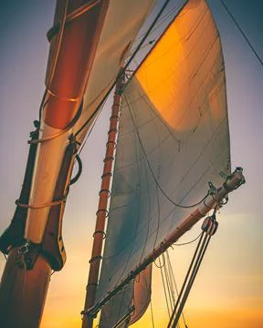 The sun hits the sails on the ocean Stock Photos