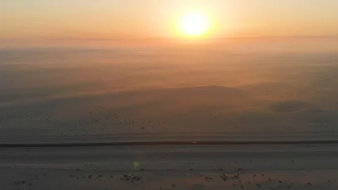 Sun at the Horizon of the Desert Stock Footage 130073210