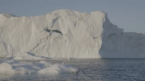 Sun Illuminating an Iceberg 1 Stock Footage 292939832
