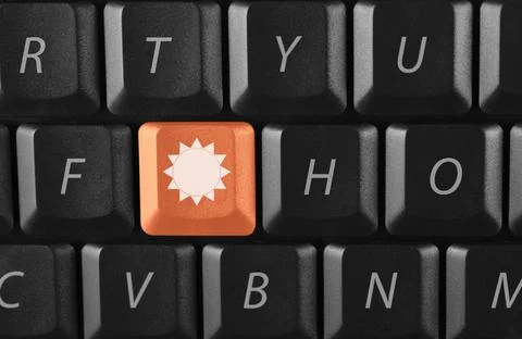 Sun key on black keyboard sun key on black keyboard Copyright: xZoonar.com... Stock-Fotos