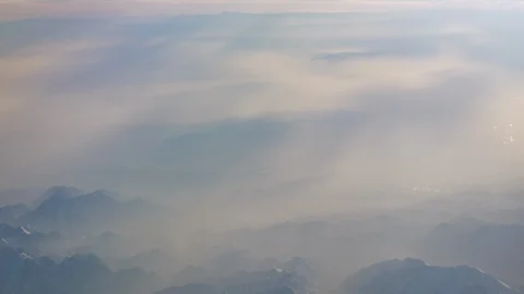 Sun light airplane mountains view 4k china Stock Footage 94441905