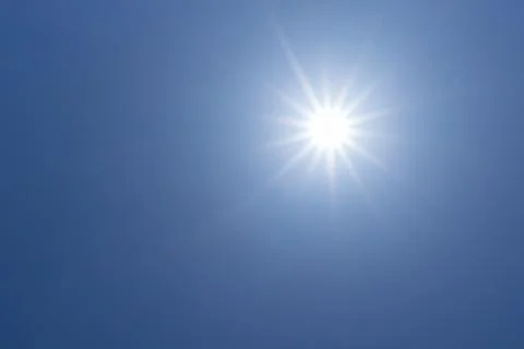 Sun light in clear blue sky with copy space Stock Photos