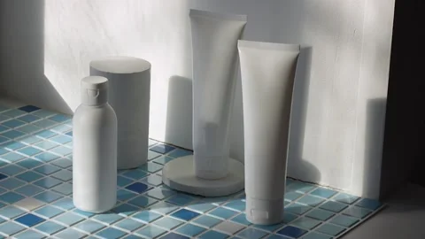 Sun light at cream lotion cleanser from blue background in a bathroom Vídeo Stock 239756969