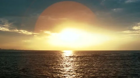 Sun Light Flare Circle Radiant before Sunset over the Sea Stock Footage 153590220