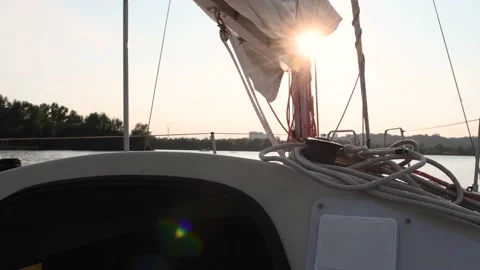 Sun light leak through the mast on the river while yachting in slow motion Stock Footage 159677922
