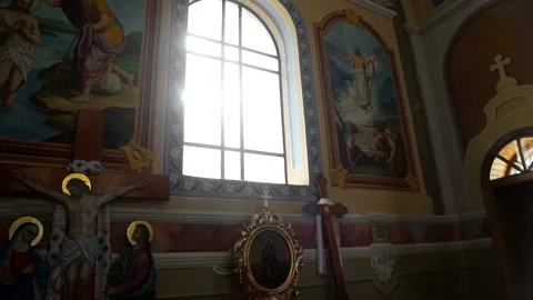 Sun light passes through the stained glass windows of the church. Blick sun Stock Footage 103575006