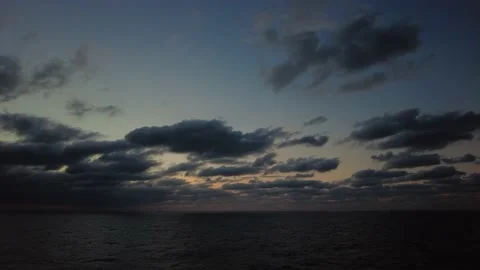 Sun light passing through clouds in the middle of the ocean Stock Footage 149086177