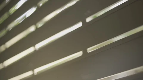Sun light passing through the cracks of closed window shutter in a house Vídeo Stock 101460543
