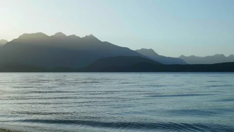 Sun light rays shining through mountain at sun set Stock Footage 260370015