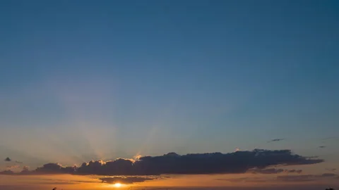 Sun Light Rays Timelapse Behind a Big Cloud during Sunset July 2021 France Video stock 157046928