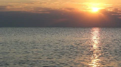 Sun light reflecting on the sea during sunrise Stock Footage 12273315