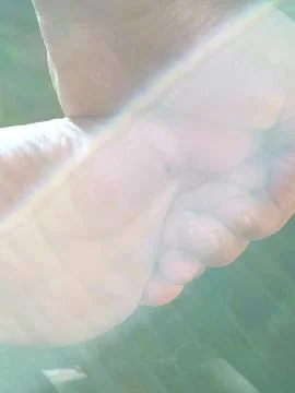 Sun light reflection on foots and hand Stock Photos